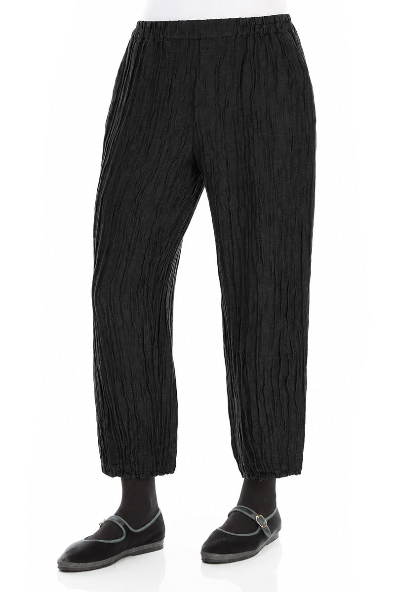 Pantalon fuselé en soie et lin noir froissé
