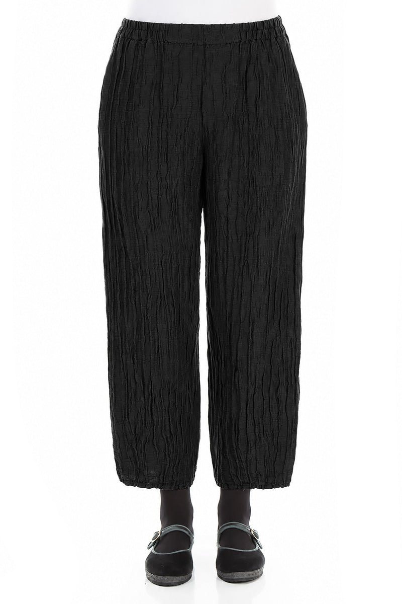 Pantalon fuselé en soie et lin noir froissé