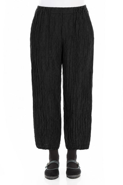 Pantalon fuselé en soie et lin noir froissé