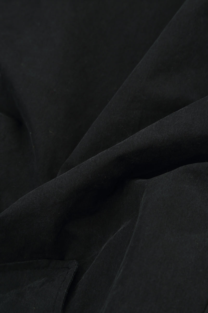 Hosen aus schwarzem Baumwoll-Twill mit Raffungen am Knie