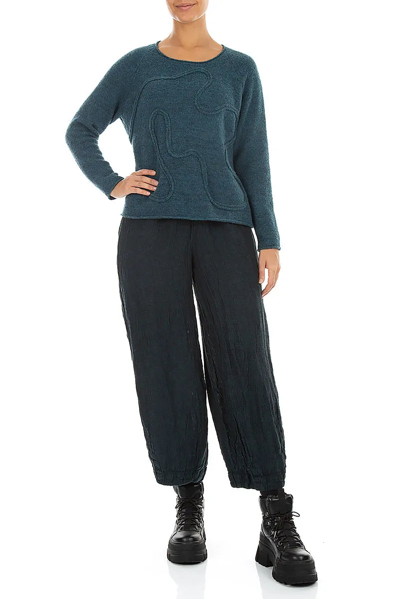 Pull en laine bleu sarcelle à couture ondulée